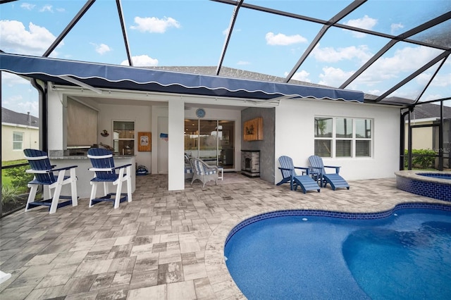 10423 Morning Marsh Ln, Parrish, FL 34219 - rear view of property featuring a patio, glass enclosure, and stucco siding