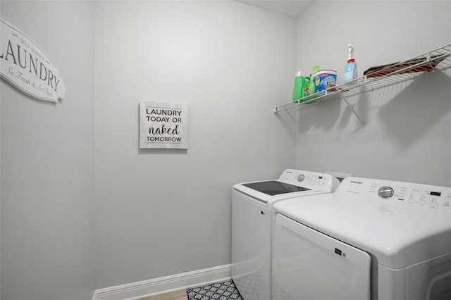 10423 Morning Marsh Ln, Parrish, FL 34219 - washroom featuring washer and clothes dryer and baseboards
