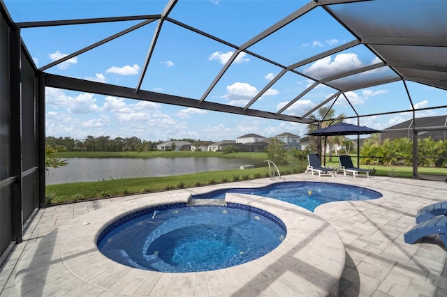 10423 Morning Marsh Ln, Parrish, FL 34219 - view of swimming pool with a patio area, a water view, glass enclosure, and a pool with connected hot tub