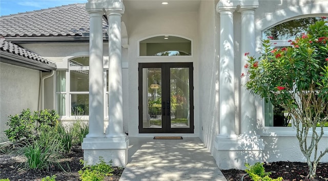 6641 Saint James Xing, University Park, FL 34201 - entrance to property featuring french doors, stucco siding, and a tiled roof