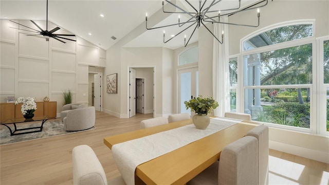 6641 Saint James Xing, University Park, FL 34201 - dining space with plenty of natural light, high vaulted ceiling, light wood-type flooring, recessed lighting, and a chandelier
