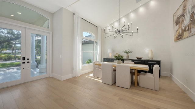 6641 Saint James Xing, University Park, FL 34201 - dining space with french doors, healthy amount of natural light, a chandelier, high vaulted ceiling, and recessed lighting