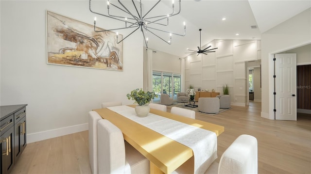 6641 Saint James Xing, University Park, FL 34201 - dining area featuring high vaulted ceiling, light wood-style floors, a chandelier, baseboards, and a ceiling fan