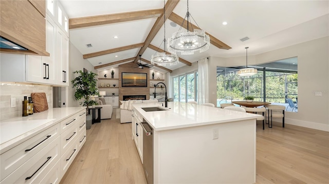 6641 Saint James Xing, University Park, FL 34201 - kitchen featuring a ceiling fan, a large fireplace, open floor plan, light wood-type flooring, and recessed lighting