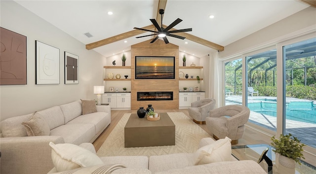 6641 Saint James Xing, University Park, FL 34201 - living area featuring light wood finished floors, a ceiling fan, a large fireplace, and recessed lighting