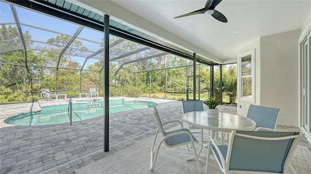 6641 Saint James Xing, University Park, FL 34201 - sunroom featuring a swimming pool, a ceiling fan, and outdoor dining space