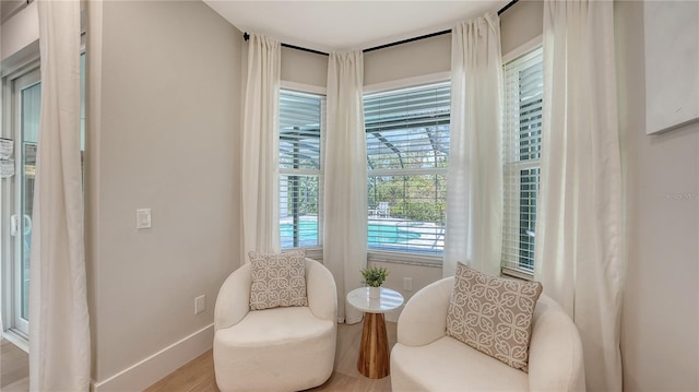 6641 Saint James Xing, University Park, FL 34201 - living area featuring wood finished floors and baseboards