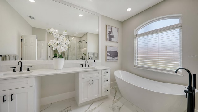 6641 Saint James Xing, University Park, FL 34201 - bathroom with a marble finish shower, double vanity, a freestanding bath, recessed lighting, and marble finish floors