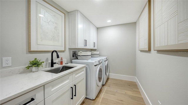 6641 Saint James Xing, University Park, FL 34201 - laundry room featuring cabinet space, independent washer and dryer, light wood finished floors, baseboards, and recessed lighting
