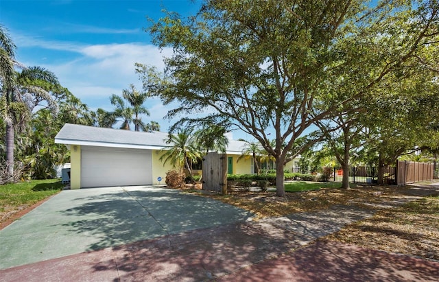 335 Arthur Dr, Sarasota, FL 34236 - view of front of property with stucco siding, a garage, and driveway