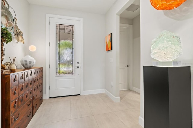 5740 Eagle Creek Rd, Sarasota, FL 34238 - foyer entrance featuring light tile patterned floors and baseboards