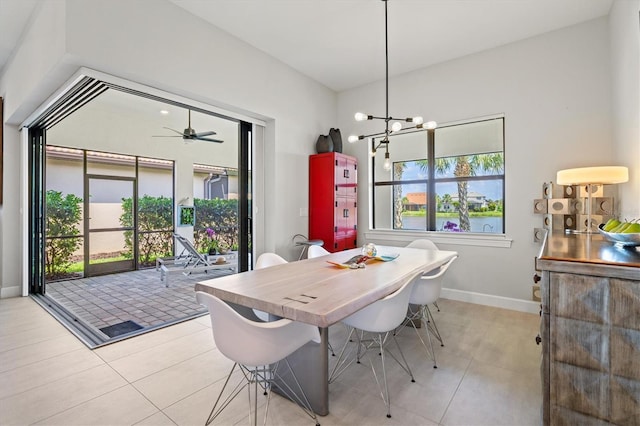 5740 Eagle Creek Rd, Sarasota, FL 34238 - dining room featuring baseboards, a chandelier, light tile patterned floors, and ceiling fan