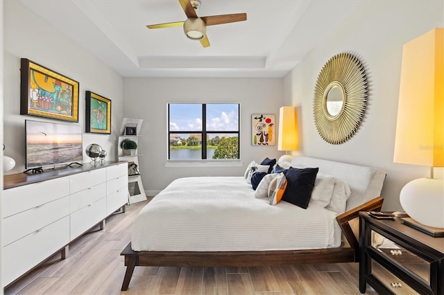 5740 Eagle Creek Rd, Sarasota, FL 34238 - bedroom with a raised ceiling, wood finished floors, and ceiling fan