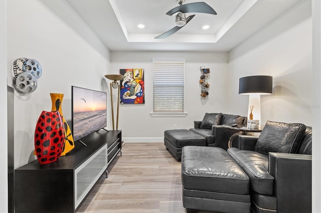 5740 Eagle Creek Rd, Sarasota, FL 34238 - living area with ceiling fan, light wood-style flooring, a raised ceiling, baseboards, and recessed lighting