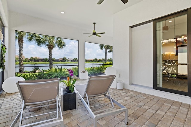 5740 Eagle Creek Rd, Sarasota, FL 34238 - sunroom with a ceiling fan and a water view