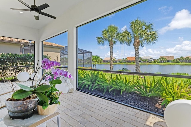 5740 Eagle Creek Rd, Sarasota, FL 34238 - sunroom / solarium with a water view and brick patterned flooring