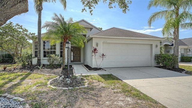 6213 Willet Ct, Lakewood Ranch, FL 34202 - single story home with stucco siding, a garage, concrete driveway, and a shingled roof