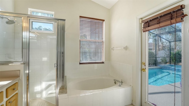 6213 Willet Ct, Lakewood Ranch, FL 34202 - full bathroom with a garden tub, a stall shower, plenty of natural light, and vaulted ceiling