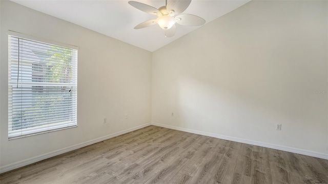 6213 Willet Ct, Lakewood Ranch, FL 34202 - empty room featuring light wood-style flooring, ceiling fan, baseboards, and lofted ceiling