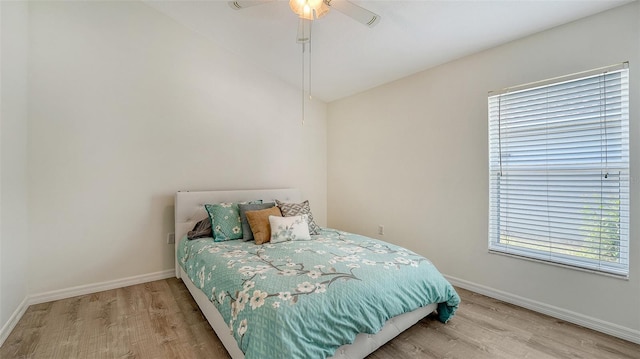 6213 Willet Ct, Lakewood Ranch, FL 34202 - bedroom with wood finished floors, baseboards, ceiling fan, and lofted ceiling