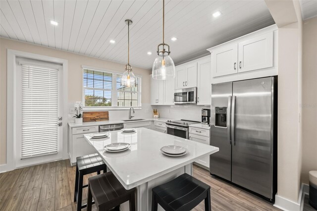4321 Marina View Way, Cortez, FL 34215 - kitchen with stainless steel appliances, recessed lighting, light countertops, light wood-style flooring, and wood ceiling
