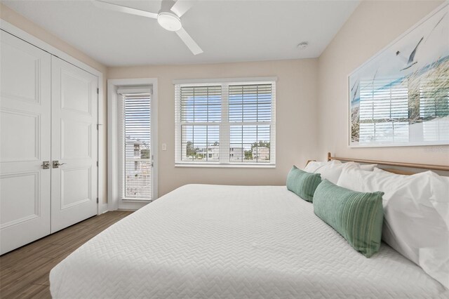 4321 Marina View Way, Cortez, FL 34215 - bedroom with wood finished floors, a ceiling fan, access to exterior, a closet, and baseboards