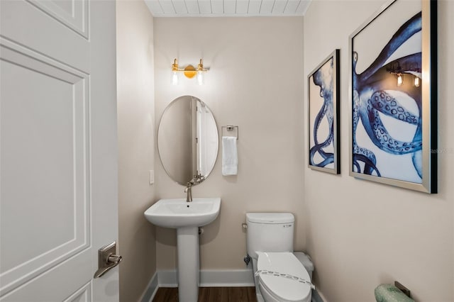 4321 Marina View Way, Cortez, FL 34215 - bathroom with toilet, wood finished floors, and baseboards