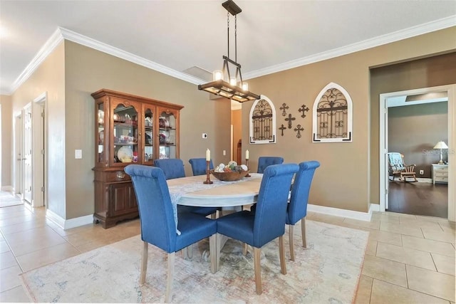 18620 Cortes Creek Blvd, Spring Hill, FL 34610 - dining area with ornamental molding, light tile patterned flooring, baseboards, and a chandelier