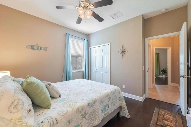 18620 Cortes Creek Blvd, Spring Hill, FL 34610 - bedroom featuring dark wood-type flooring, a closet, baseboards, and ceiling fan