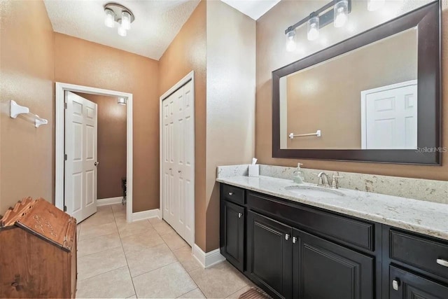 18620 Cortes Creek Blvd, Spring Hill, FL 34610 - bathroom featuring vanity, tile patterned flooring, and baseboards