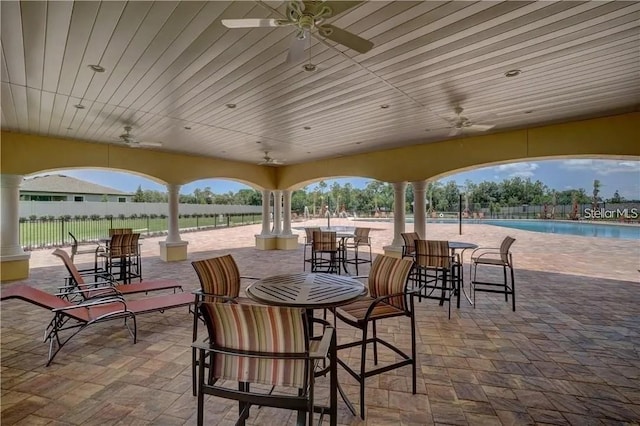 18620 Cortes Creek Blvd, Spring Hill, FL 34610 - view of patio with ceiling fan and a community pool