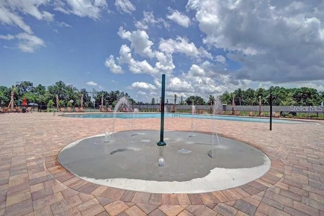 18620 Cortes Creek Blvd, Spring Hill, FL 34610 - surrounding community featuring a pool and a patio area