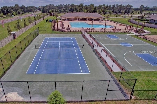 18620 Cortes Creek Blvd, Spring Hill, FL 34610 - bird's eye view of a pool area and a tree filled landscape