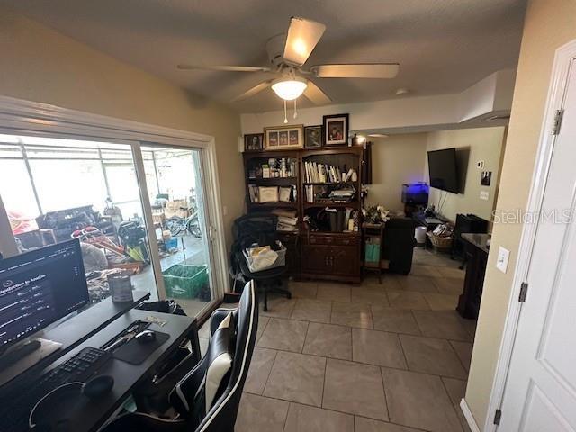 2094 Penn Dr, Deland, FL 32724 - office area featuring ceiling fan and light tile patterned floors