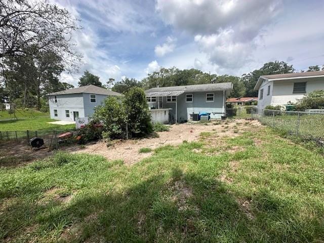 2094 Penn Dr, Deland, FL 32724 - rear view of property with a fenced backyard and central AC