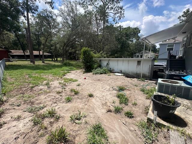 2094 Penn Dr, Deland, FL 32724 - view of yard with central air condition unit