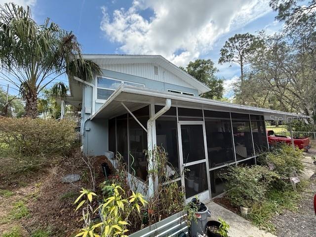 2094 Penn Dr, Deland, FL 32724 - view of home's exterior featuring a sunroom