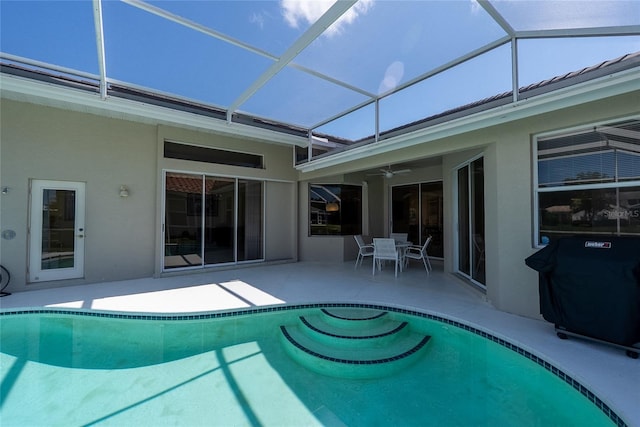 4257 Hearthstone Dr, Sarasota, FL 34238 - outdoor pool with ceiling fan, a patio area, a grill, and a lanai