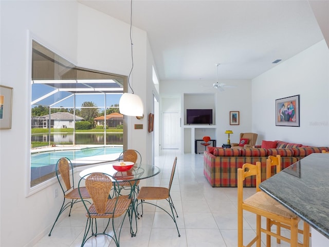 4257 Hearthstone Dr, Sarasota, FL 34238 - dining room with a ceiling fan and light tile patterned flooring
