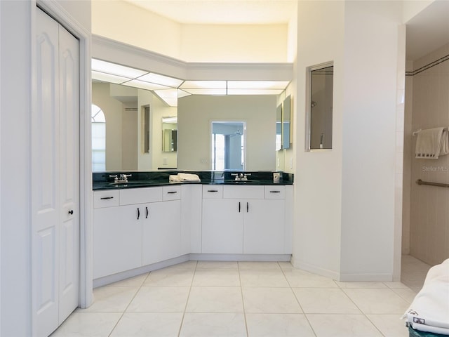 4257 Hearthstone Dr, Sarasota, FL 34238 - bathroom with double vanity, tile patterned floors, plenty of natural light, and a shower