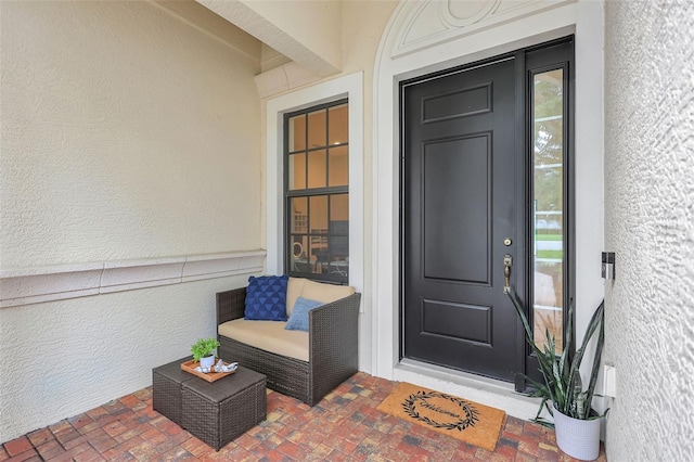 12710 Stone Ridge Pl, Lakewood Ranch, FL 34202 - doorway to property with stucco siding