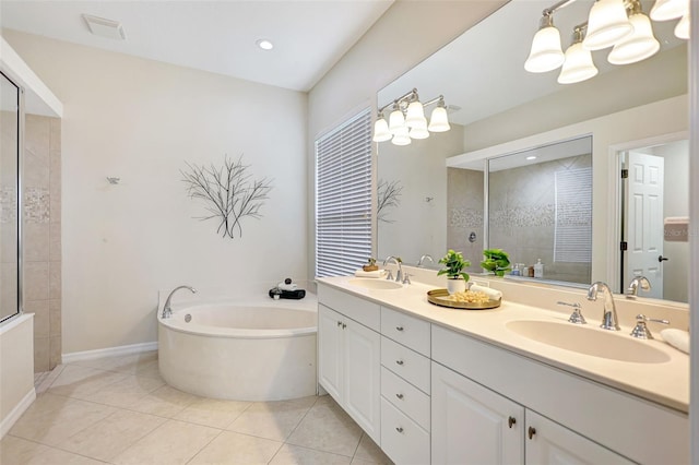 12710 Stone Ridge Pl, Lakewood Ranch, FL 34202 - full bath featuring tiled shower, double vanity, a bath, tile patterned flooring, and baseboards