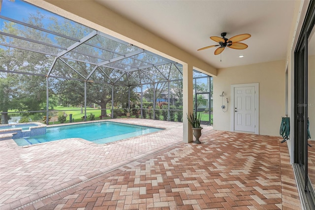12710 Stone Ridge Pl, Lakewood Ranch, FL 34202 - view of pool with a patio area, ceiling fan, a pool with connected hot tub, glass enclosure, and view of scattered trees