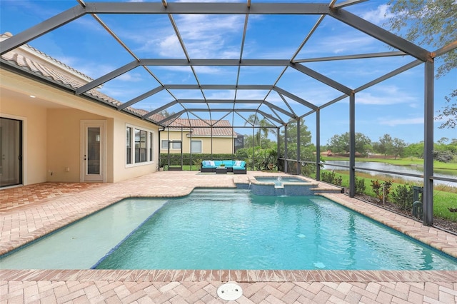 12710 Stone Ridge Pl, Lakewood Ranch, FL 34202 - view of swimming pool featuring an outdoor hangout area, a patio, a water view, a pool with connected hot tub, and glass enclosure