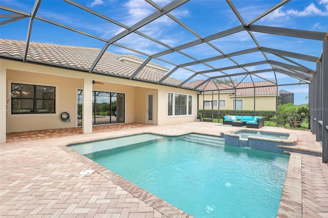 12710 Stone Ridge Pl, Lakewood Ranch, FL 34202 - view of pool featuring outdoor lounge area, a patio, a pool with connected hot tub, and glass enclosure