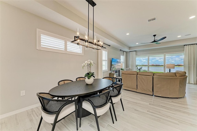 909 Crosswind Ave, Sarasota, FL 34240 - dining space with ceiling fan, baseboards, a chandelier, recessed lighting, and light wood-style flooring
