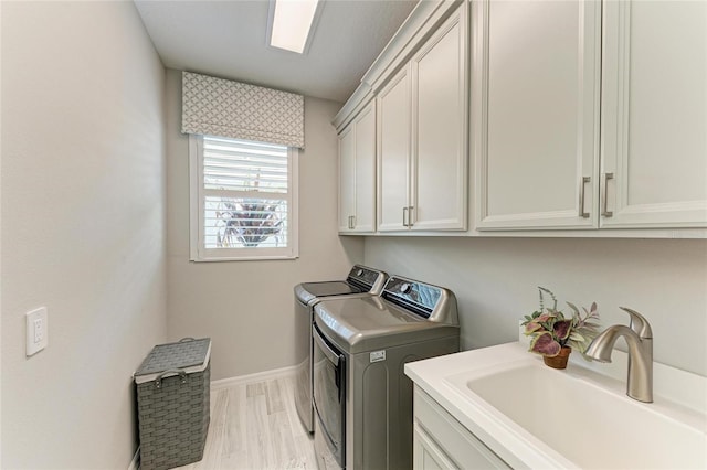 909 Crosswind Ave, Sarasota, FL 34240 - washroom with independent washer and dryer, cabinet space, and baseboards