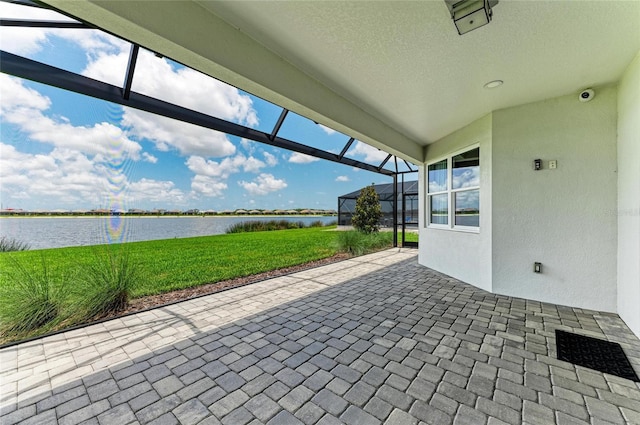 909 Crosswind Ave, Sarasota, FL 34240 - view of patio / terrace with a water view and glass enclosure