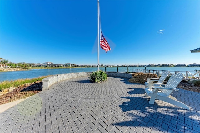 909 Crosswind Ave, Sarasota, FL 34240 - view of home's community featuring a patio area and a water view
