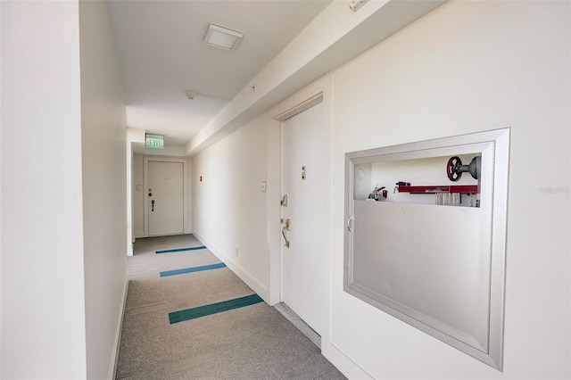 2425 Gulf Of Mexico Dr Unit 14B, Longboat Key, FL 34228 - hallway with carpet flooring